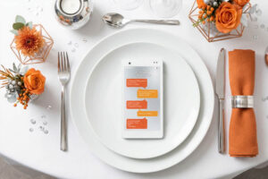 menu smartphone orange et et gris sur assiette